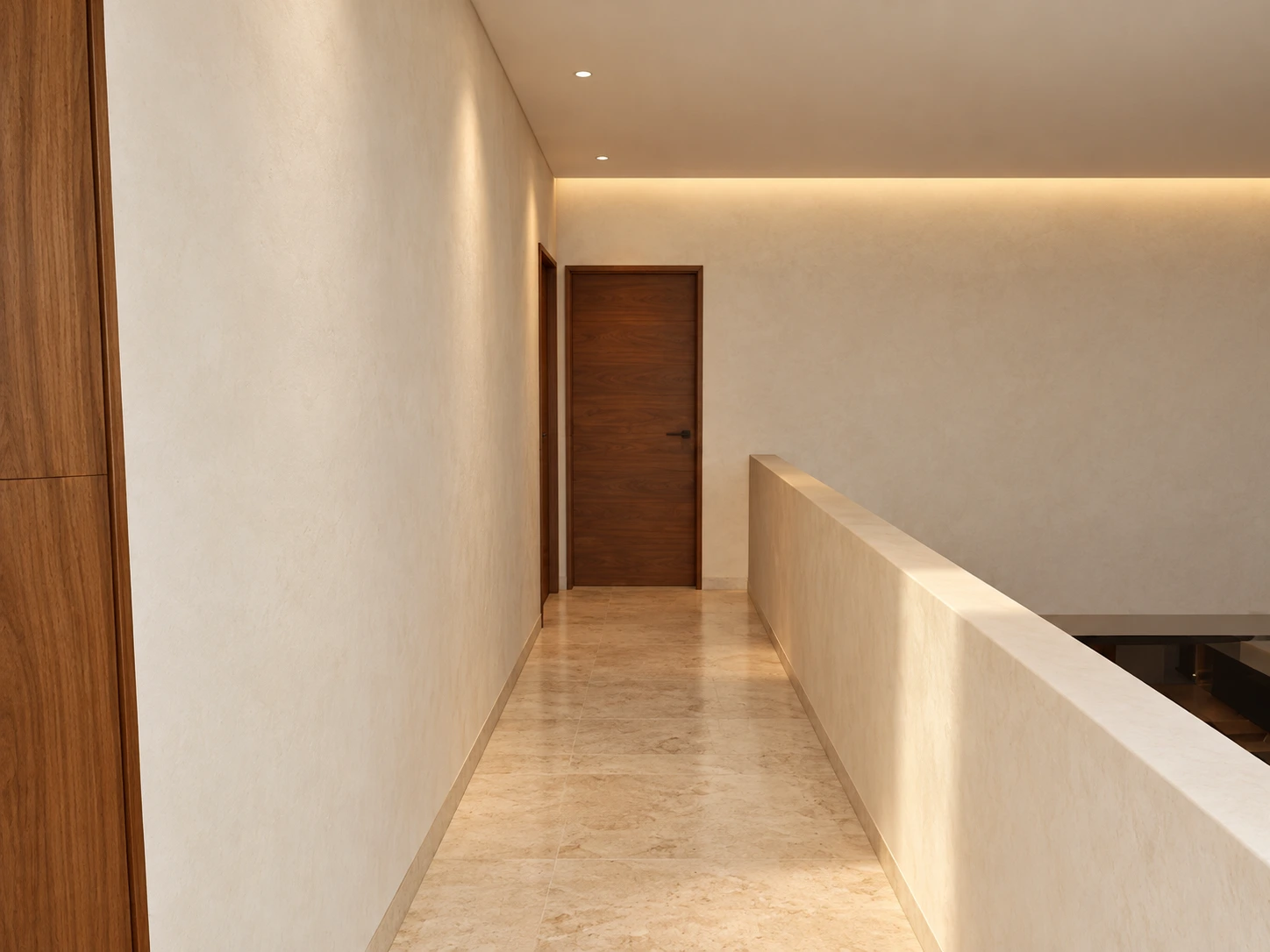 Pasillo de piedra clara con puertas de madera y muro sobre la doble altura